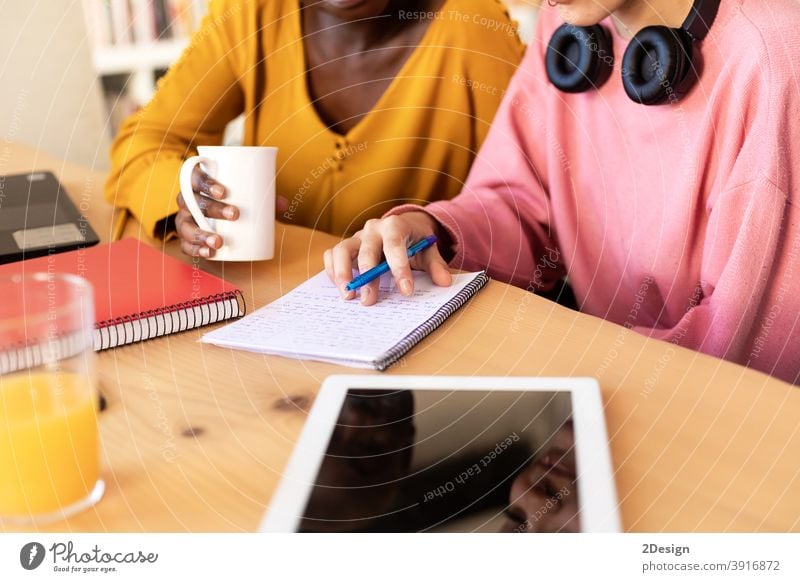 Closeup of casual smiling start up businesswomen talking at coffee break office meeting working happiness discussion two people business person laptop teamwork