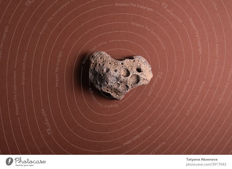 Heart shaped stone on brown rock abstract textured heart geology material rough nature old close-up cracked mineral surface detail no people