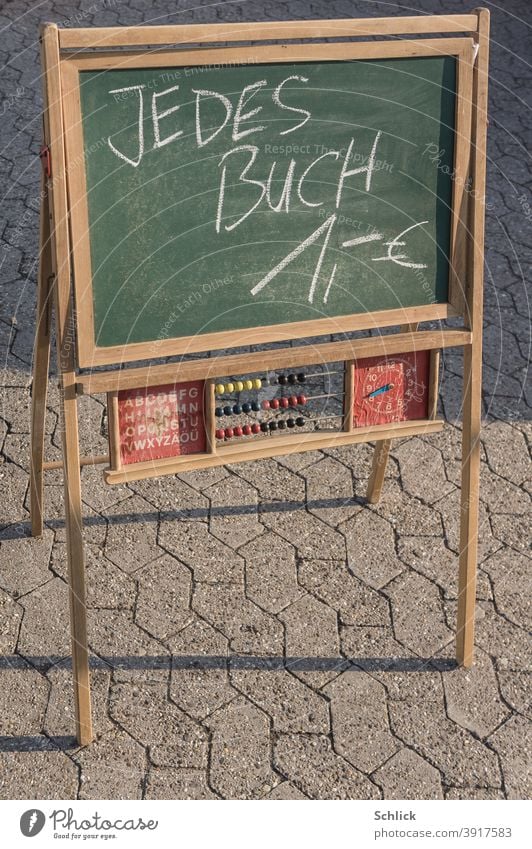 Board for children with abacus clock and Latin capital letters with the inscription Each book 1 Euro Children's board Text books sale Flea market Blackboard