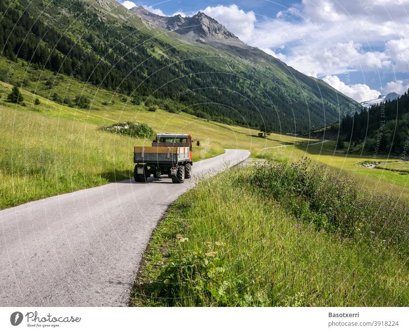 Agricultural vehicle on the way to the Jamtal during the hay harvest in July. Galtür, Paznaun, Tyrol, Austria paznaun Vehicle Agriculture Hay Hay harvest jamtal