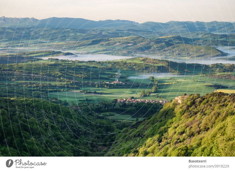 Morning view of the Treviño area, seen from the top of Zaldiaran. Vitoria, Basque Country, Spain alava Sunrise Fog Morning fog May Spring Village Villages