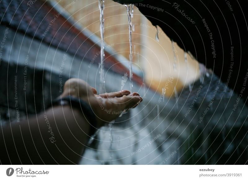 rainy season Rain Weather Hand Water Rainy weather Drops of water Wet rainy day raindrops Bad weather Colour photo Copy Space