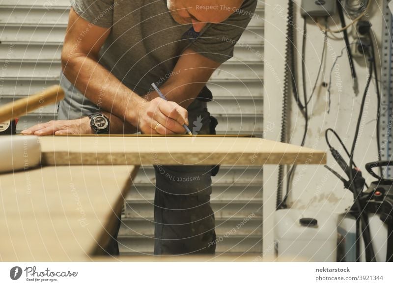 Carpenter Drawing Line on Wood man caucasian worker workshop diy no hair 1 person garage working line wood carpenter carpentry background handiwork industrial