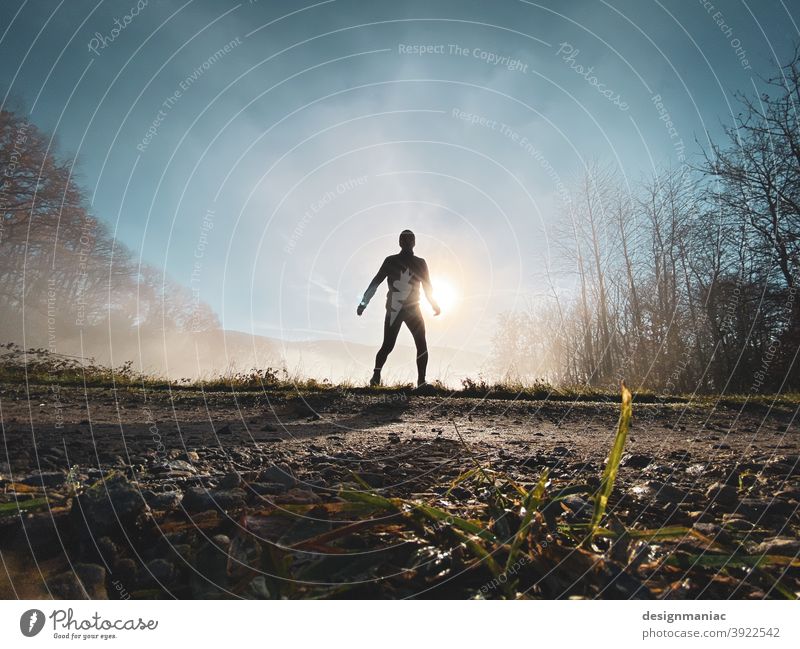 The X-Files: The Jogger in the Mist Silhouette Fog Above the clouds Clouds Amazing Mystic File x trees Lanes & trails Grass Cold cold season Sky Sky blue cloudy