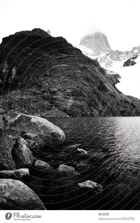 Black and white photo of Cerro Fitzroy Black & white photo Mountain Rock Lake Exterior shot Peak Landscape Snowcapped peak Deserted Day Environment Nature Sky