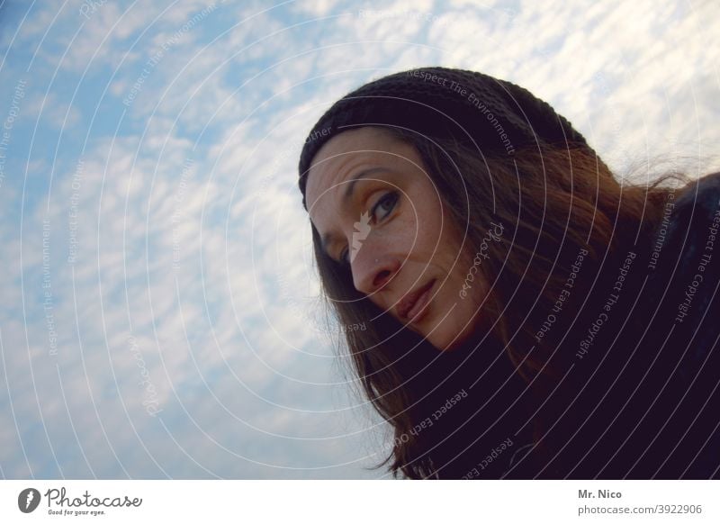 facial expression Looking portrait Woman Looking into the camera pretty Feminine Face Long-haired naturally Cap Sky Clouds Brash Cheeky in the camera grin