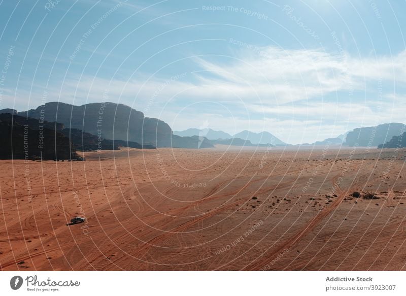 Amazing view of dry desert and mountains on sunny day sandstone valley landscape scenery hot climate wadi rum jordan blue sky formation nature terrain rock