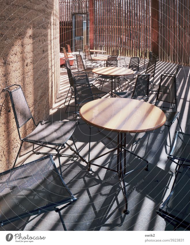 Chairs, Tables, Strips Café interior Mysterious Abstract tables chairs Closed Gastronomy Seating Empty Deep Insight Design Stripe Shaft of light Modern Simple