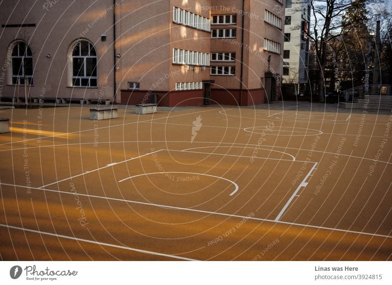 An empty basketball court in Stuttgart, Germany. Children must be having a break from school. A moody afternoon walk around Stuttgart. playground