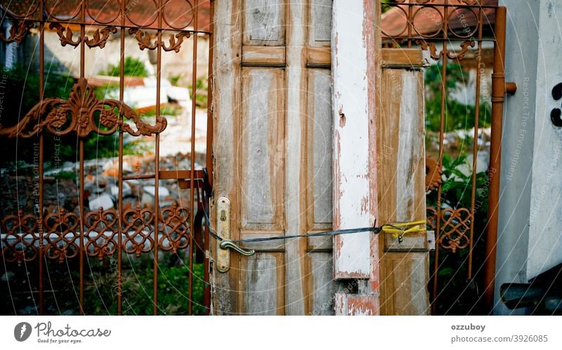 rustic door on fence Door Rustic Damage Fence Entrance Front door Door handle Wooden door Colour photo Closed Structures and shapes Detail door handle Old