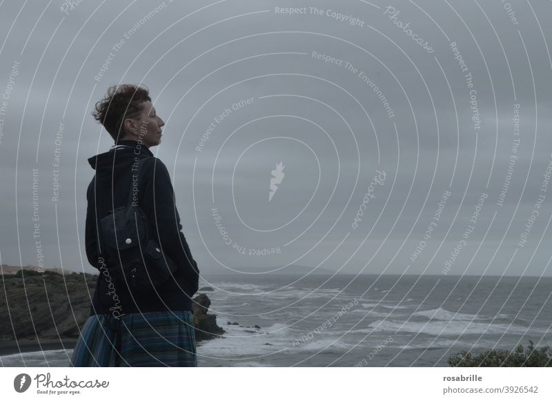 Woman looking over stormy sea | far away confident Ocean Looking Far-off places Future bleak courageous Defiant despite circumstances wide Bad weather Situation