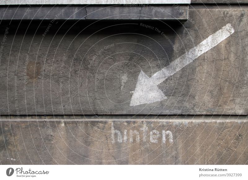 notice on the façade of the house for the air shelter Facade House (Residential Structure) house wall Building Behind Arrow Direction Clue mark label info