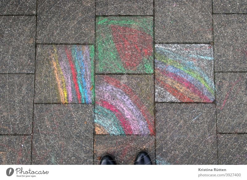 view of chalk painted pavement slabs Rainbow painting Painted children's chalk crayon street chalk street-painting chalk Chalk Sidewalk off Street Ground