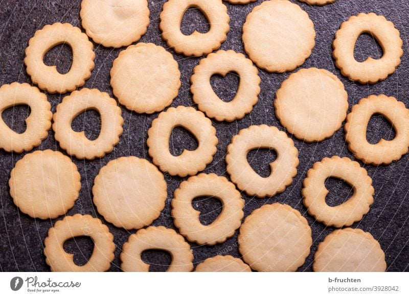 Biscuits waiting for their filling Christmas biscuits cookie cutter heart-shaped Christmas & Advent Cookie Baked goods Baking Delicious cut out cookies cute