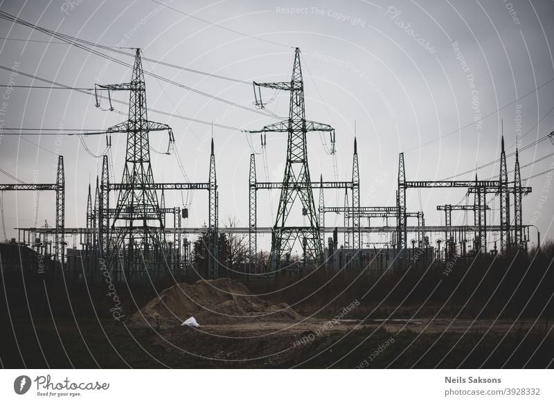 high voltage post, high voltage tower cloudy sky background electric power power grid electric utility power station utilities electricity blue cable