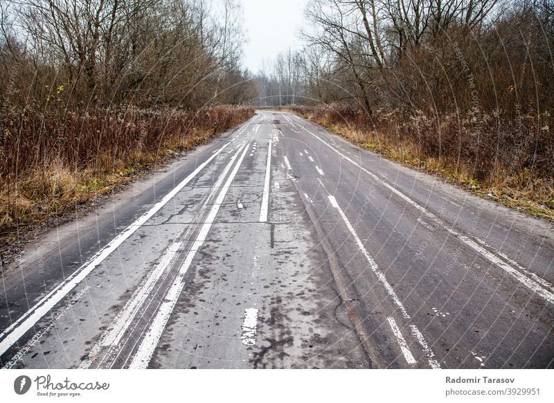 old abandoned asphalt road with spoiled road markings white background street line black urban surface way abstract texture view outdoor paint lane symbol