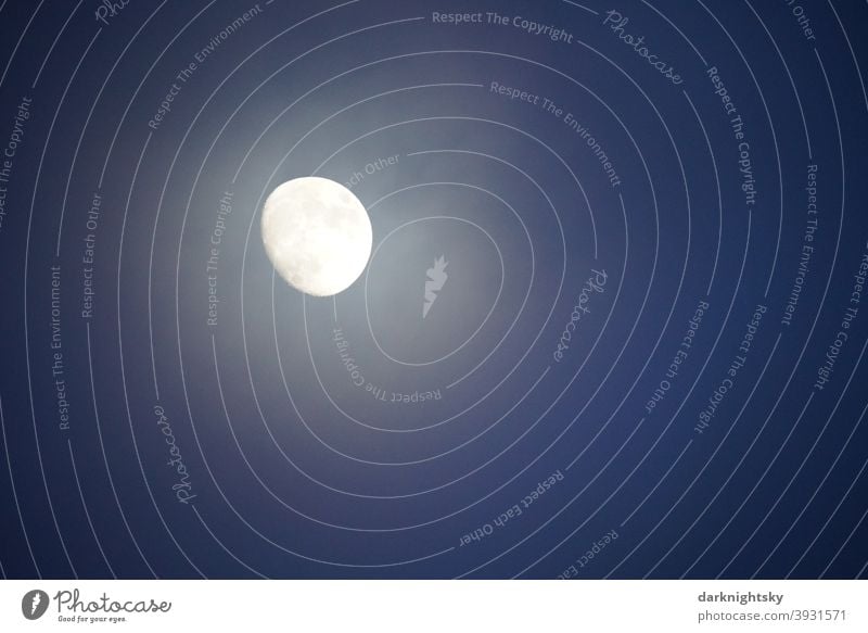 Three-quarter full moon in December with a veil of clouds at the evening blue hour. Moon Sky Clouds Celestial bodies and the universe Moonlight Blue Universe