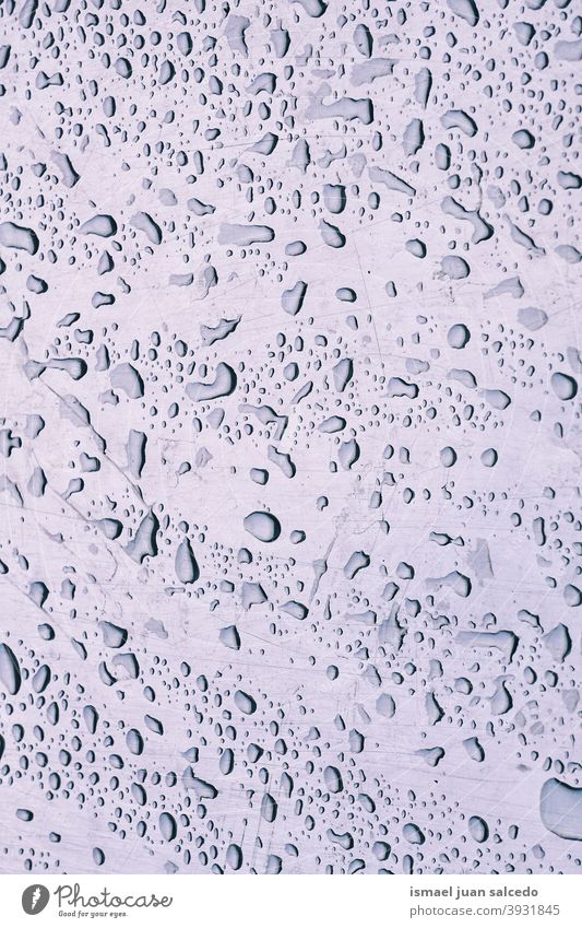 raindrops on the window water wet abstract background textured bright rainy rainy days winter gray color grey patter Drops of water Rainy weather Bad weather