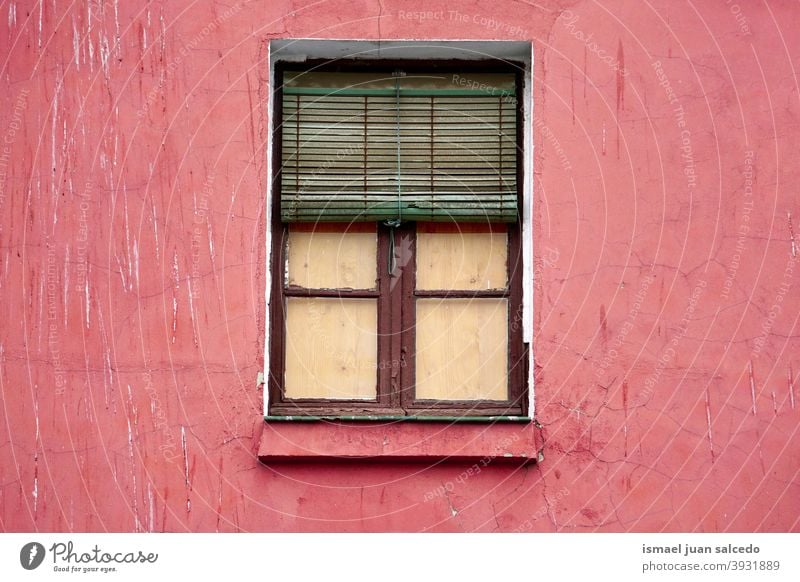 window on the red facade of the house, architecture in Bilbao city Spain building exterior home street outdoors color colorful structure construction wall