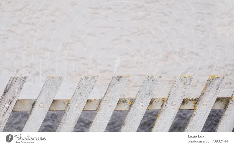 Picket fence, in the slope lattice fence Garden fence Frisian Fence Wooden fence Facade Gray White Old obliquely Deserted Exterior shot Day Colour photo