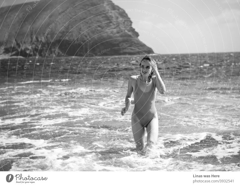 Tenerife is always a wonderful place to visit. In this picture, you can find an exceptionally picturesque location in South Tenerife called La Montaña Roja. This mountain is almost as gorgeous as this happy girl with a swimsuit.