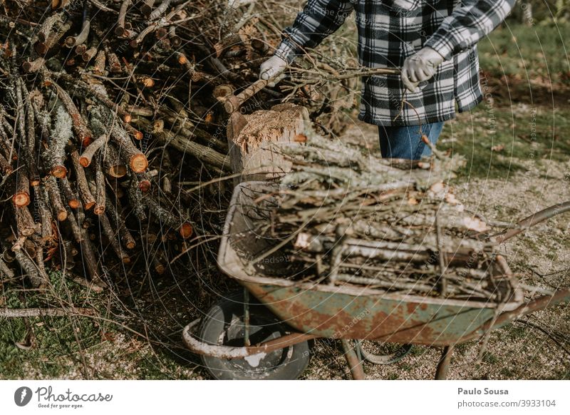 Man cutting firewood Firewood Unrecognizable Cut faceless anonymous unrecognizable work crop copy space horizontal occupation professional Winter Cold job busy