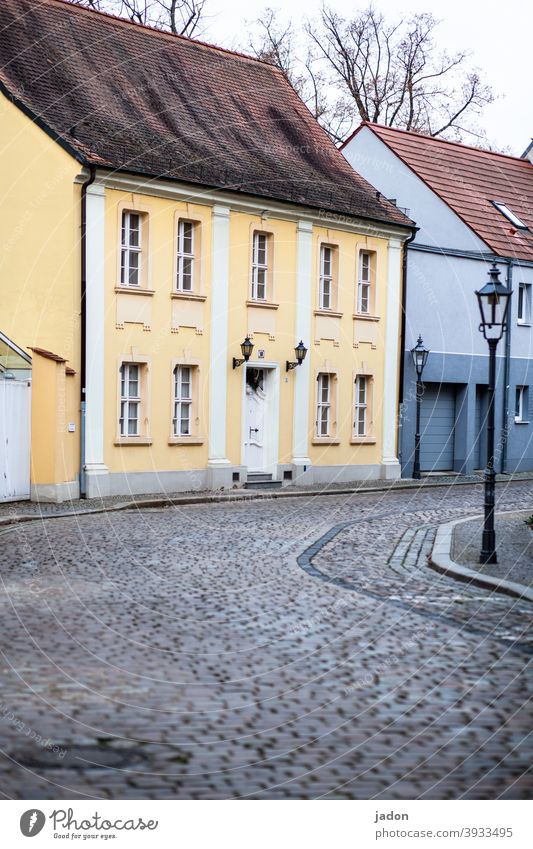 empty streets (35). Street Paving stone Lantern Facade Exterior shot Deserted Town Lanes & trails House (Residential Structure) Wall (building) Window