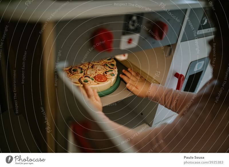 Child playing toy kitchen childhood Playing having fun at home simulation Kitchen Toys cheerful little playful cute kid happy enjoy lifestyle adorable happiness