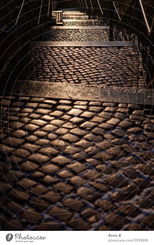 Cathedral stairs down - Cathedral stairs up stagger Stairs rail Cobblestones Historic Historic Buildings Seating Bench Shadow Light reflection Evening Dusk