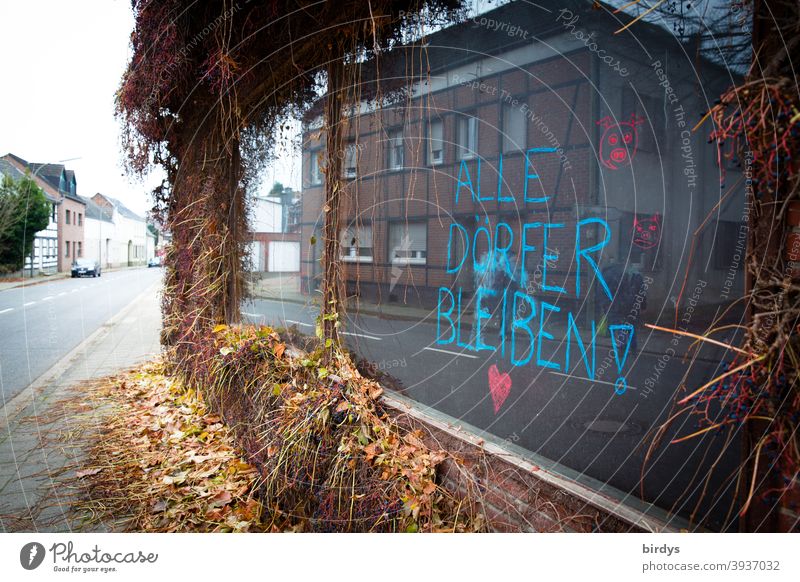 Keyenberg, village on the edge of the Garzweiler2 opencast lignite mine is to be completely destroyed and dredged by RWE by 2023. Protest statement on a shop window