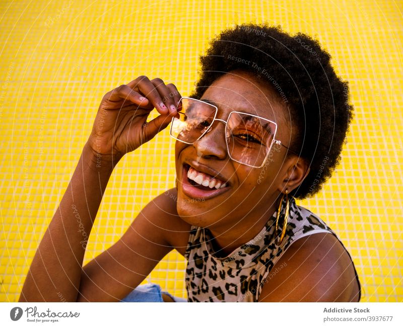 Laughing black hipster woman in stylish sunglasses style trendy cheerful laugh afro modern young female african american ethnic optimist eyewear eyeglasses