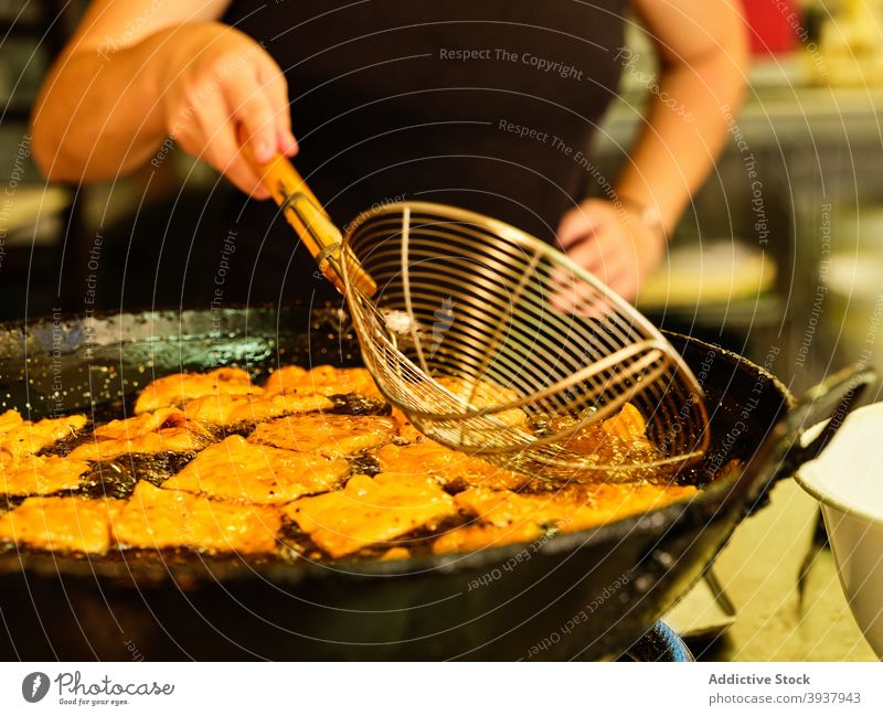 Chef preparing deep fried pastry dough fry chef prepare oil kitchen culinary food professional cook cuisine work process job occupation gastronomy hot ladle