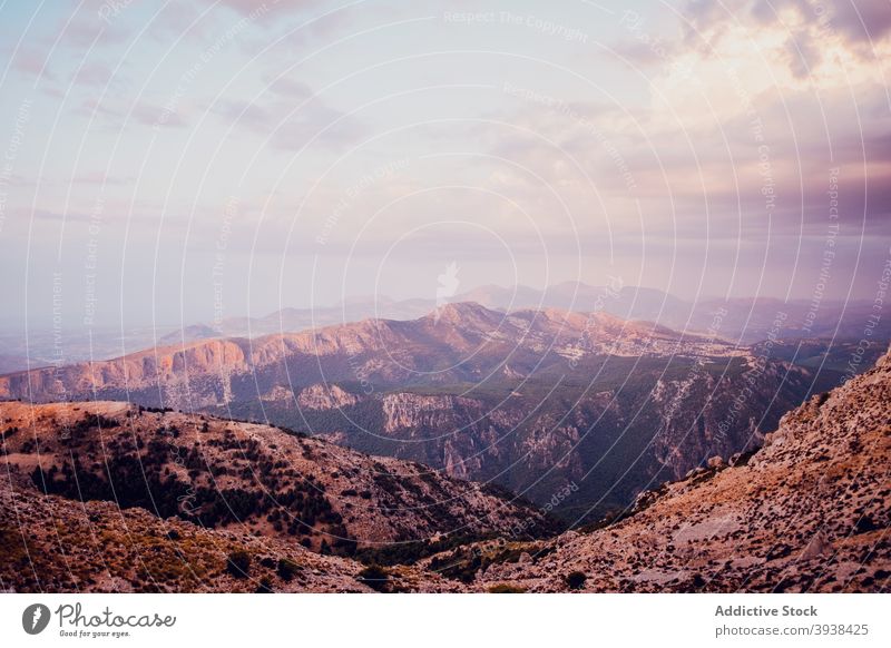 Picturesque mountain landscape against sundown sky in Spain nature sunset ridge highland peak tree range scenic picturesque breathtaking rocky cloudy la pandera