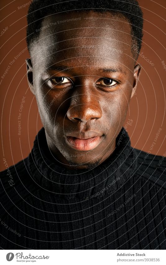 Thoughtful black man in casual outfit in studio thoughtful pensive serious think contemplate style male ethnic african american ponder young focus wistful