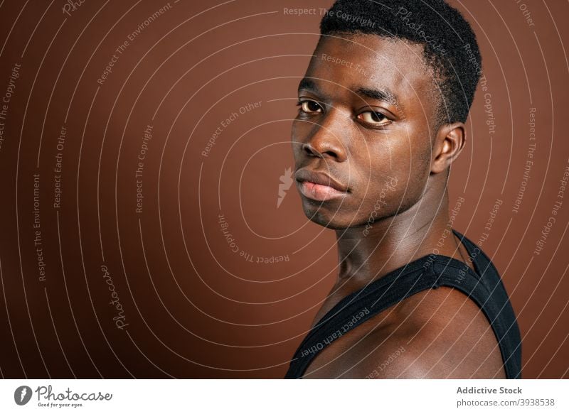 Thoughtful black man in casual outfit in studio thoughtful pensive serious think contemplate style male ethnic african american ponder young focus wistful