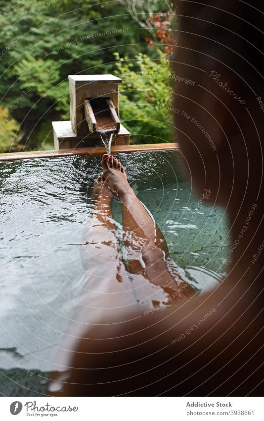 Legs of female traveler in Japanese onsen 30s young woman caucasian attractive tourist tourism gues