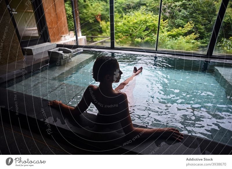 Silhouette of young caucasian woman in Japanese onsen 30s attractive tourist tourism gues