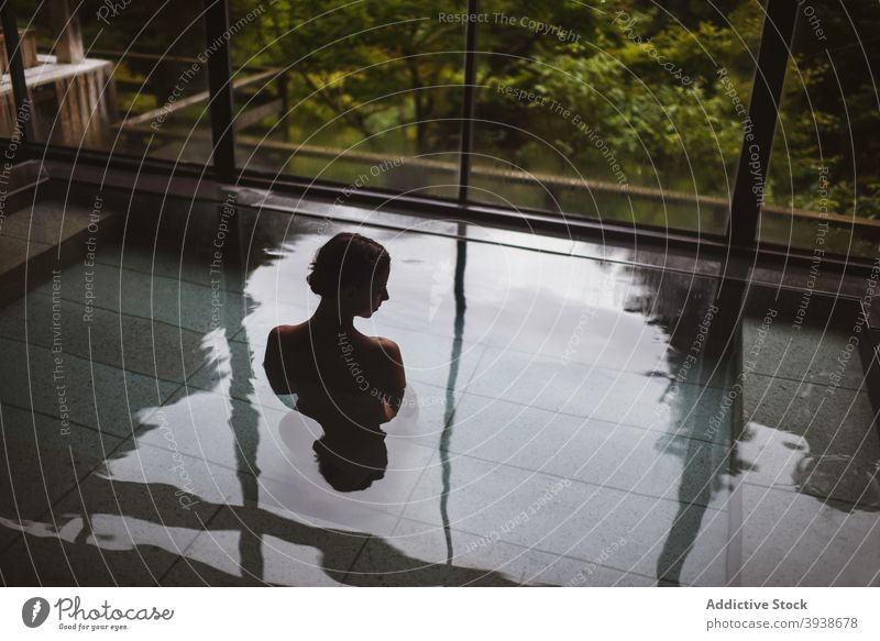 Silhouette of young caucasian woman in Japanese onsen 30s attractive tourist tourism gues