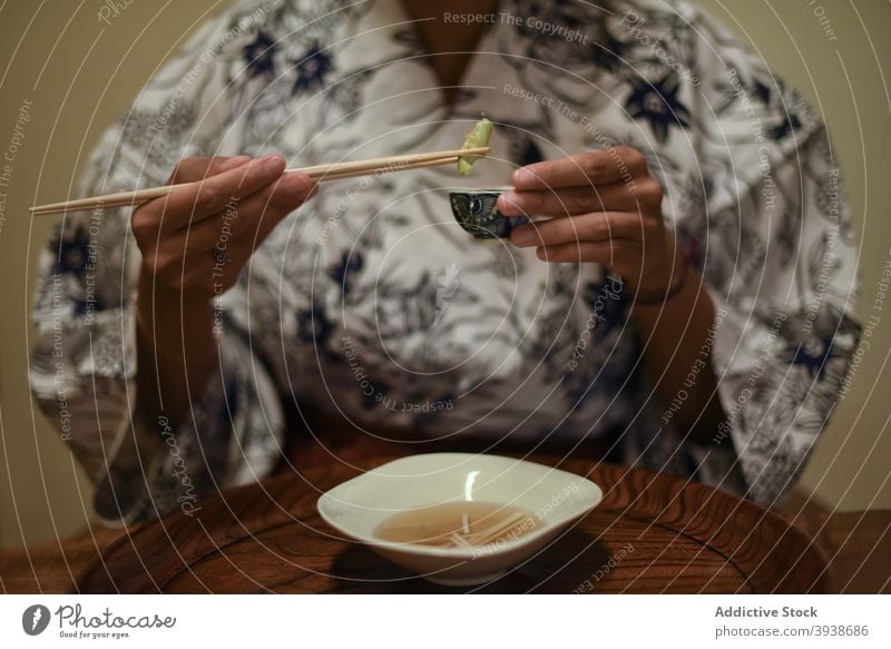 Young caucasian in a kimono eating at a Japanese Ryokan 30s young woman attractive tourist tourism gues