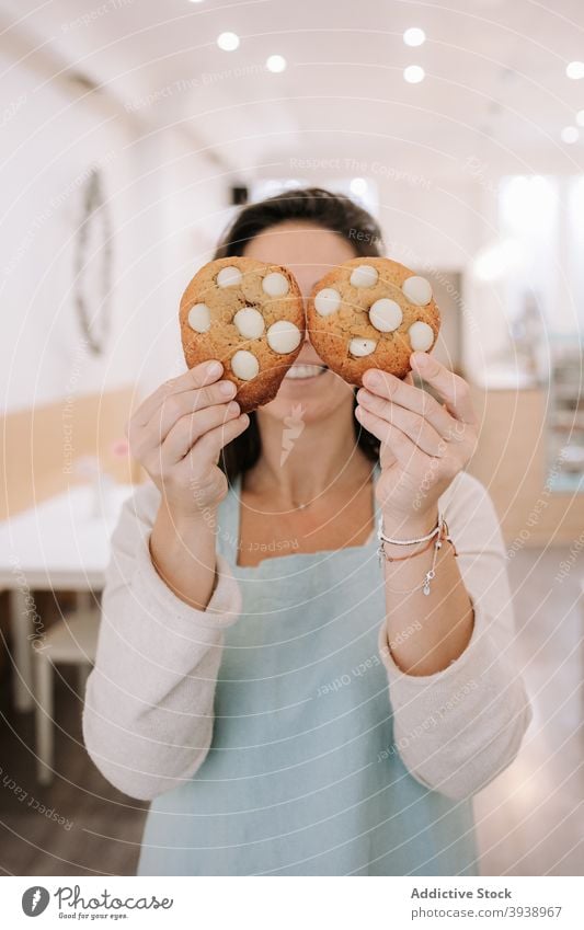 Funny female demonstrating delicious sweet cookies bake gourmet homemade chips gesture holding funny cute woman happy eyes snack looking food caucasian