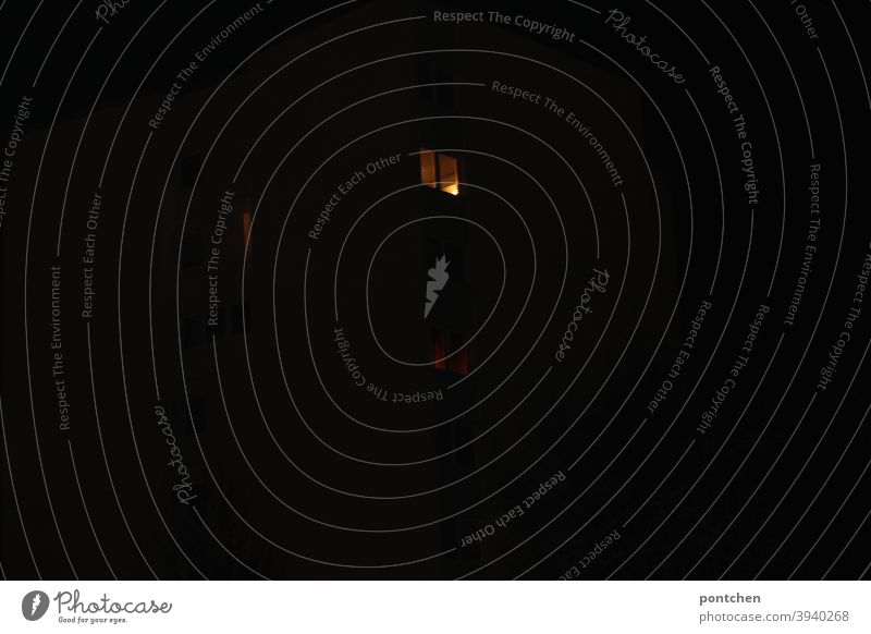 Illuminated windows in the dark Window dwell Night Light darkness House (Residential Structure) Facade apartment building Fear Hope Belief anonymity