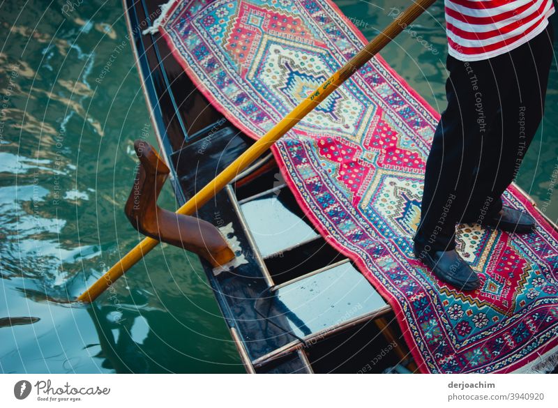 The gondolier in the boat stands on a carpet Venice Italy Canal Grande Watercraft Channel Gondola (Boat) Tourism Boating trip Gondolier Vacation & Travel Day