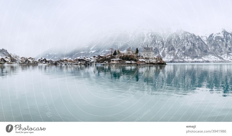 Iseltwald, Bernese Oberland, Switzerland in winter Winter Snow Mountain Alps Lake Water Thun Brienz lake Blue Cold Tourism Destination Panorama (Format) Village