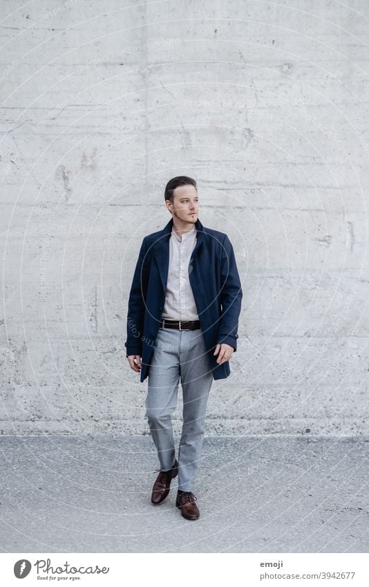 young man, business, outside in front of concrete wall masculine more adult Young man Man Business Businessman Concrete inquisitorial View to the side Doubt