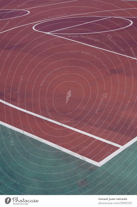 red basket court, street basket in Bilbao city Spain basketball sport field lines markings colors colorful ground play playing park playground outdoors