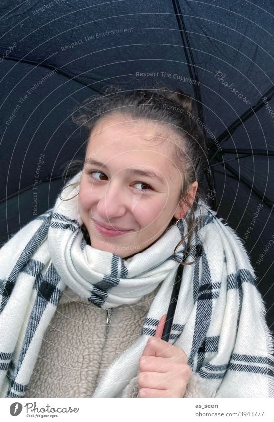 Happy in the rain Girl Scarf Umbrella rainy weather Rain Autumn Wet Weather Bad weather Exterior shot Colour photo Day Drops of water Water Climate Human being