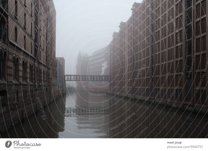 Hamburg, Speicherstadt in the morning mist storehouse city Fleet Fog Diffuse foggy Monochrome Subdued colour Landmark Tourism City trip Season Autumn Winter