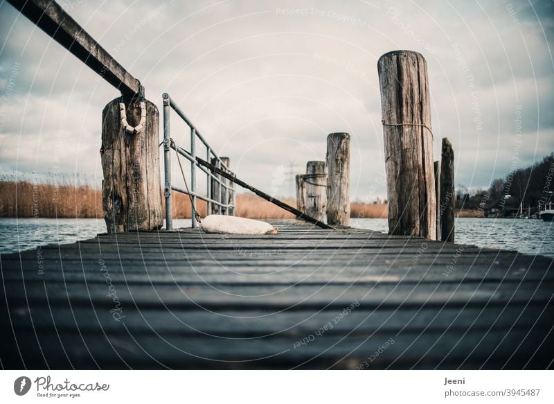 On the wooden jetty at a small fishing harbour *200*. Fishing village wooden walkway Footbridge Baltic Sea Lake Harbour Water coast Lakeside River bank rail