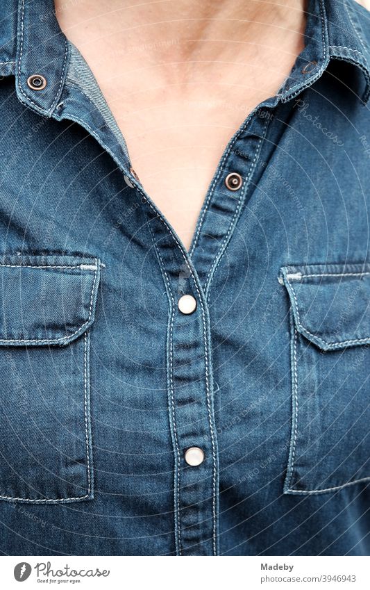 Beautiful woman in summer in blue denim dress with two breast pockets and bare skin jeans Dress Denim dress detail Summer Fashion Blue Buttons press studs Bag