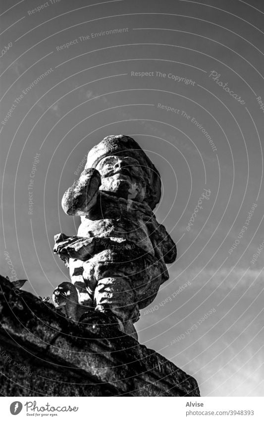 looking into the future statue medieval sculpture landmark architecture city tourism monument europe art stone old travel gaze cityscape detail building tower